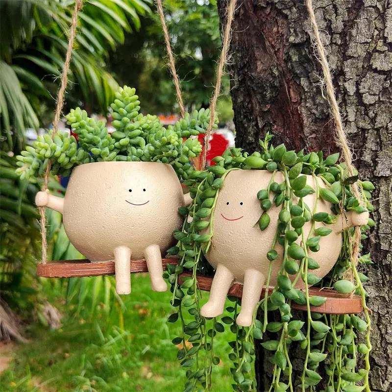Smiley™ - Schaukelnder Blumentopf