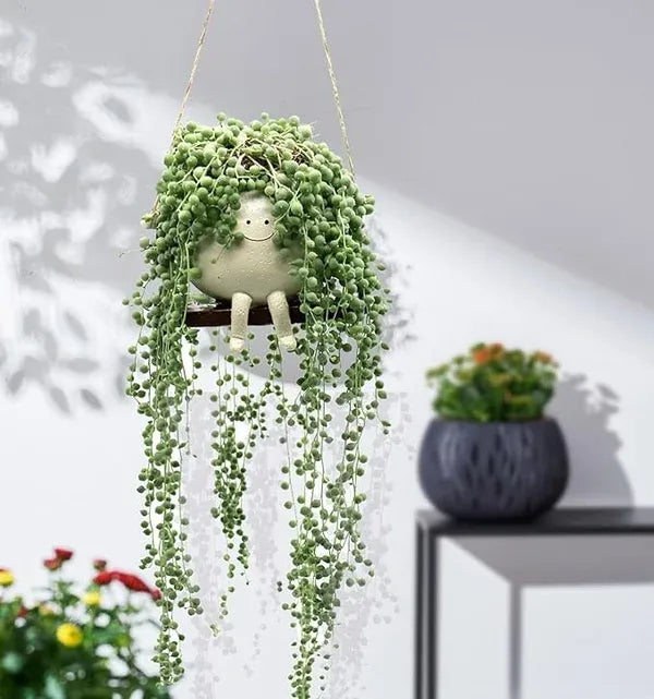 Smiley™ - Schaukelnder Blumentopf