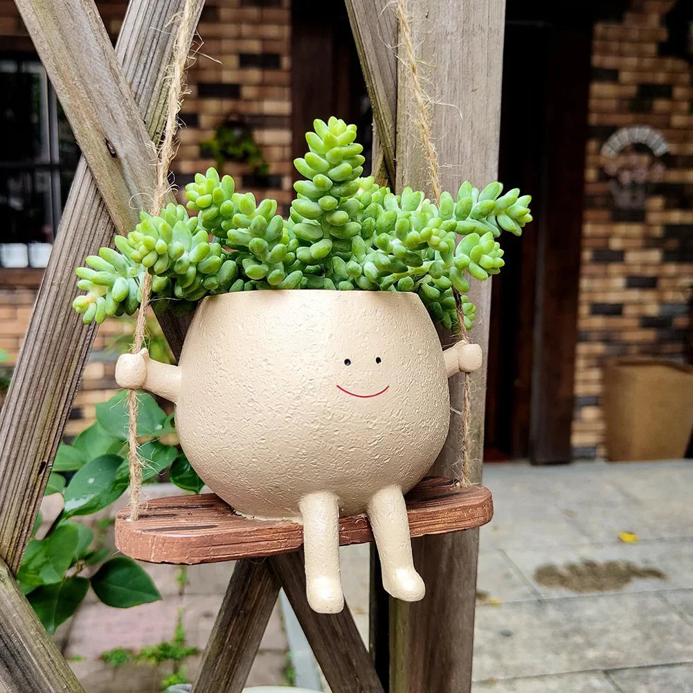 Smiley™ - Schaukelnder Blumentopf